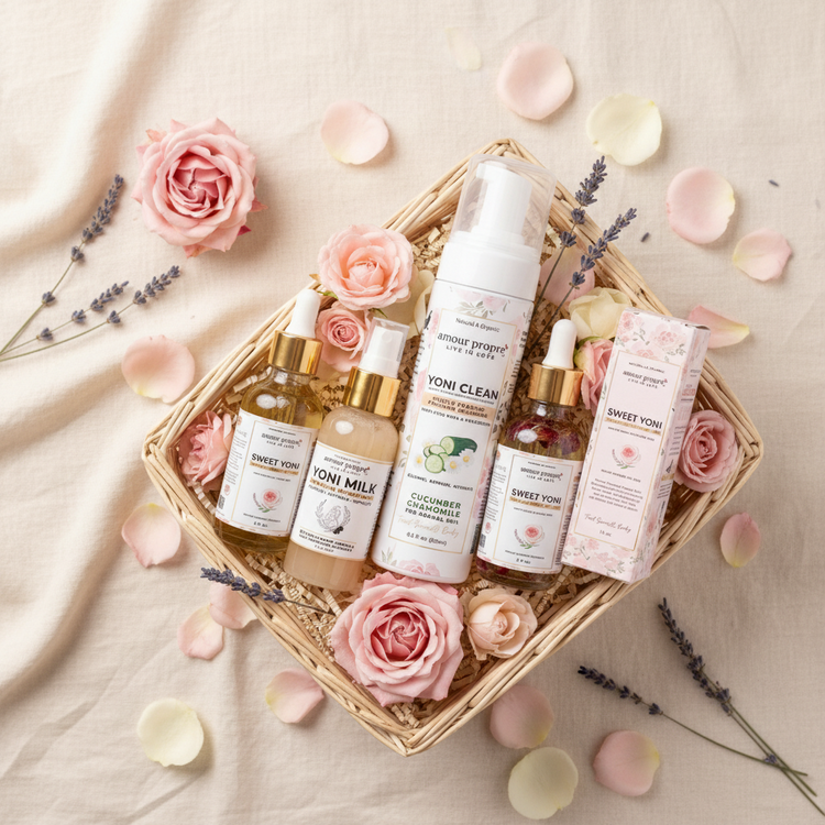 Set of skincare products on a wooden surface with a pink background