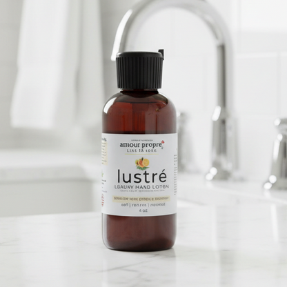 Amour Propre Lustré Luxury Hand Lotion bottle on a bathroom counter