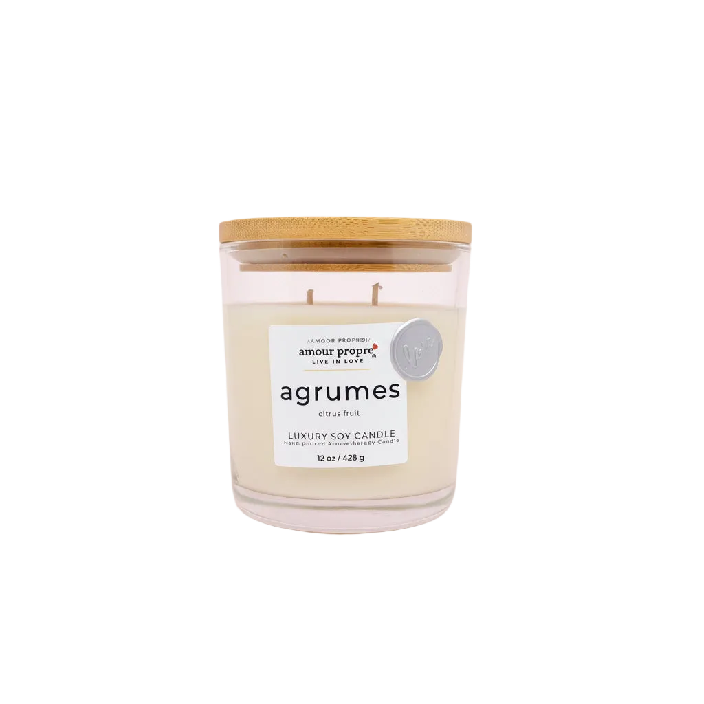 Agrumes candle with a wooden lid on a white background
