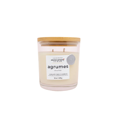 Agrumes candle with a wooden lid on a white background