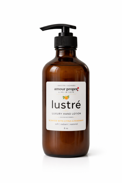 Amber lotion bottle with pump labeled 'lustré' on a white background