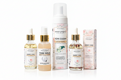 Collection of natural products including bottles and a box on a wooden surface with a neutral background.